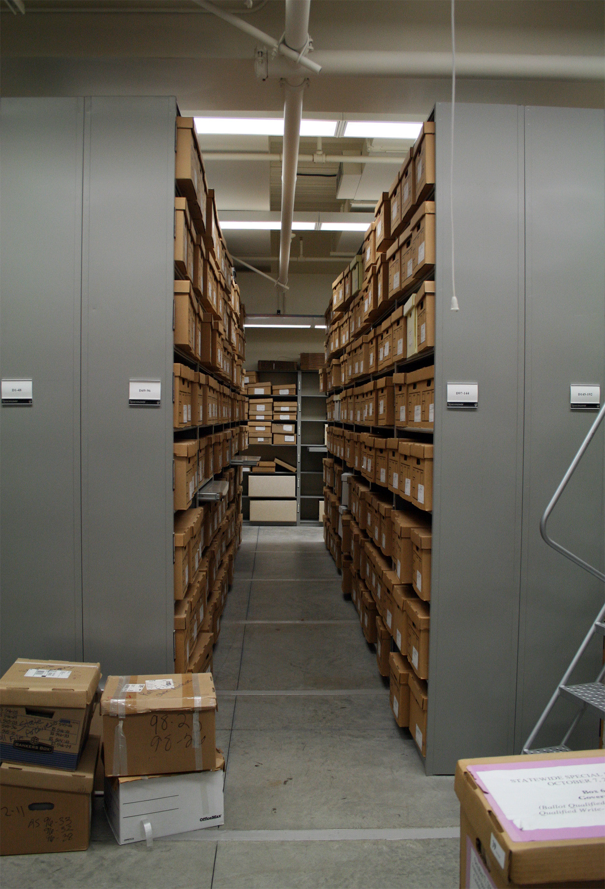 Rows of labeled record boxes at the California State Archives