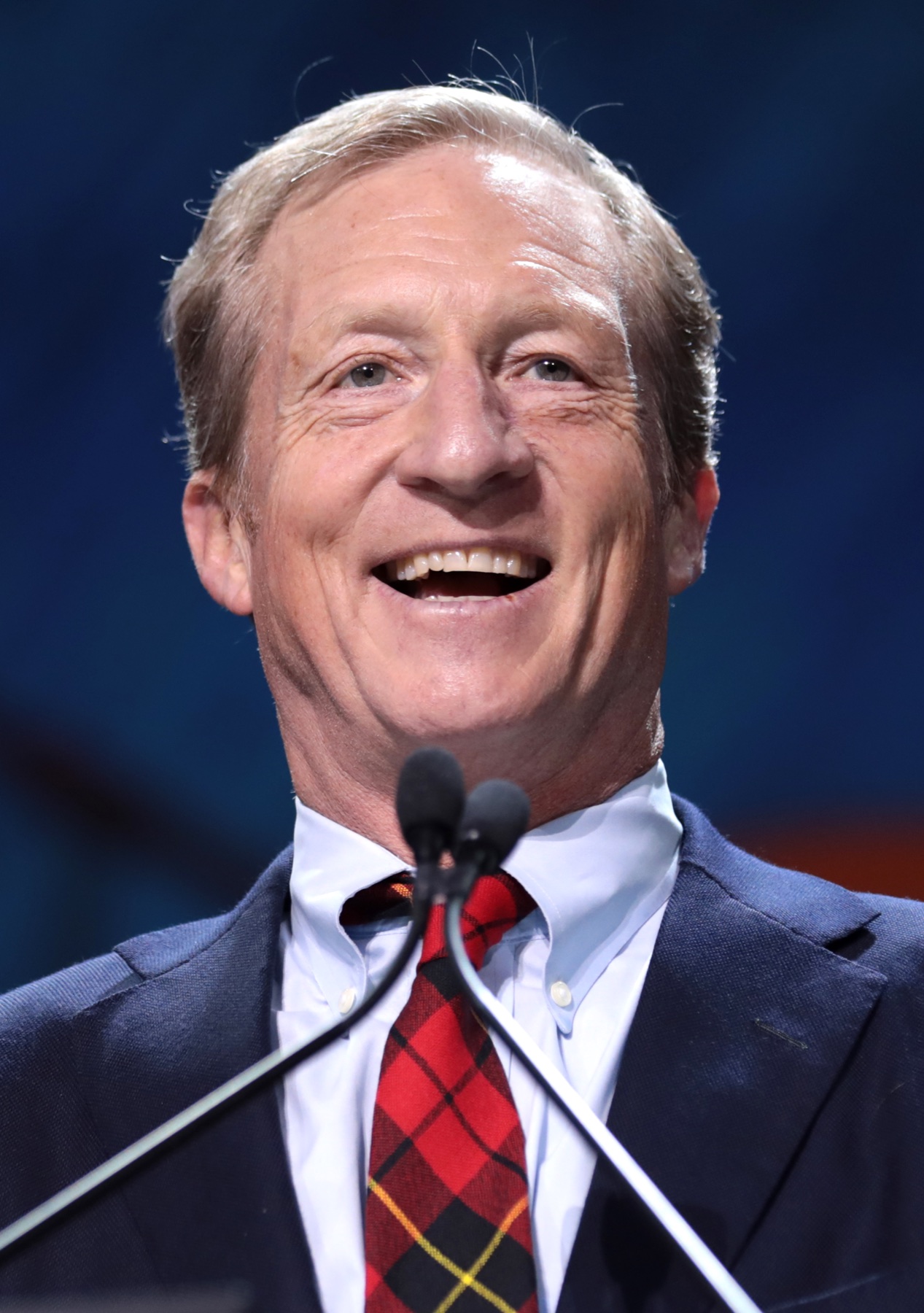 Tom Steyer speaking at a lectern